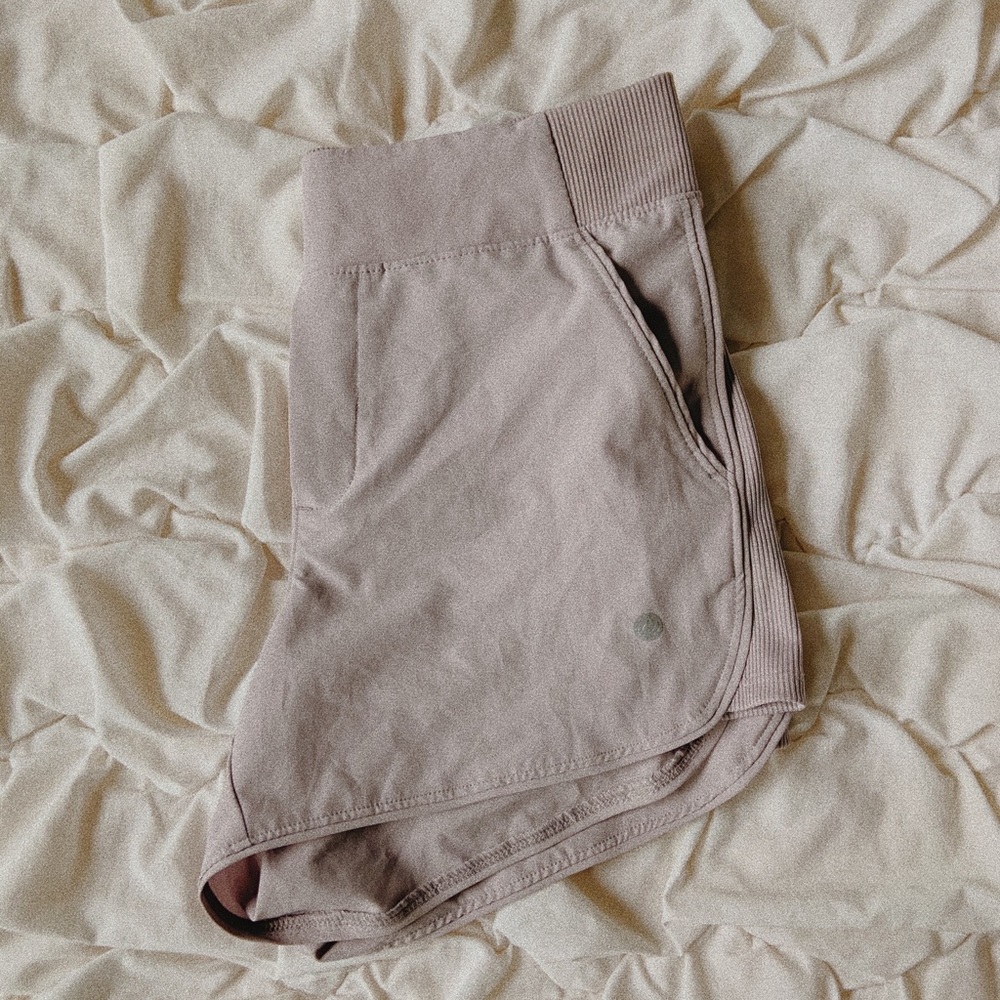 Light pinkish-grey athletic shorts